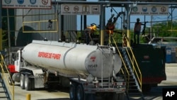 FILE - A gas distribution truck fills up at the Varreux Terminal in Port-au-Prince, Haiti, Nov. 12, 2021. The terminal, Haiti’s main entry point for fuel, has been blocked by armed gangs since mid-September 2022, causing widespread fuel shortages.
