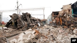 FILE - Debris covers a railway depot ruined after a Russian rocket attack in Kharkiv, Ukraine, Sept. 28, 2022.