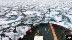 FILE - This summer 2018 photo provided by the National Oceanic and Atmospheric Administration shows the U.S. Coast Guard icebreaker Healy on a research cruise in the Chukchi Sea of the Arctic Ocean.