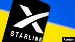 FILE - The Starlink logo is seen on a smartphone in front of a displayed Ukrainian flag in this illustration taken Feb. 27, 2022. 