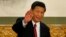 FILE - Xi Jinping waves in Beijing's Great Hall of the People on Nov. 15, 2012. 