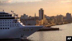 FILE - The MSC Opera cruise ship leaves the harbor in Havana, Cuba, on Feb. 4, 2016. Geneva-based MSC Cruises was hired by Qatari World Cup organizers to operate a third cruise ship, the 1,075-cabin MSC Opera, as a soccer fans' hotel during the World Cup that begins in November. 