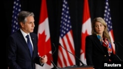 Canada's Foreign Minister Melanie Joly listens as U.S. Secretary of State Antony Blinken speaks during a news conference, in Ottawa, Ontario, Canada Oct. 27, 2022.