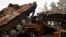 FILE - Destroyed Russian tanks and armored vehicles from Russia's invasion of Ukraine are seen stacked up in the liberated town of Lyman, Donetsk region, Ukraine, Oct. 5, 2022. 