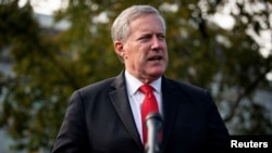 FILE - Then-White House Chief of Staff Mark Meadows speaks to reporters following a television interview, outside the White House in Washington, Oct. 21, 2020.