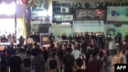 FILE - Protesters take to the streets of Sanandaj, the capital of Iran's Kurdistan province, Sept. 28, 2022, as demonstrations continue to spread after the death of Mahsa Amini in custody, in this screen grab taken from a UGC video.