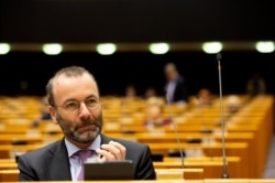 FILE - German MEP Manfred Weber attends a session in the Plenary chamber of the European Parliament in Brussels, March 10, 2020.