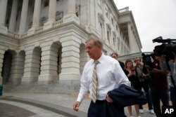 Sen. Lindsey Graham, R-S.C., departs Capitol Hill, Oct. 6, 2018, in Washington.