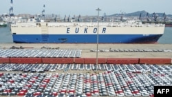 This aerial photo taken April 13, 2022, shows cars that will be exported at Yantai port, in China's eastern Shandong province.