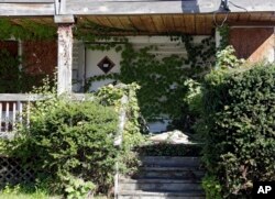 A boarded-up home in East Cleveland, Ohio, Sept. 24, 2014, one of the Midwest states hardest hit by the foreclosure crisis that began several years before the housing bubble fully burst in late 2007.