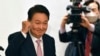 FILE - South Korea's president-elect Yoon Suk-yeol gestures during a ceremony disbanding the presidential election camp at the National Assembly Library in Seoul on March 10, 2022. 