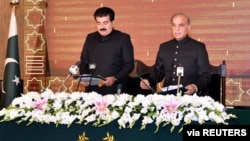 FILE - Pakistan's prime minister-elect Shehbaz Sharif takes oath as the 23rd Prime Minister of Pakistan from Muhammad Sadiq Sanjrani, Chairman of the Senate of Pakistan, at President Office in Islamabad, Pakistan, April 11, 2022.