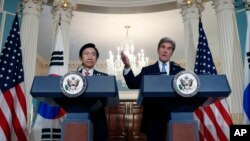 South Korean Foreign Minister Yun Byung-se listens as Secretary of State John Kerry speaks to the media, Oct. 19, 2016, at the State Department in Washington.