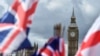 British national flags flutter near the The Elizabeth Tower, commonly referred to as Big Ben, in central London. 