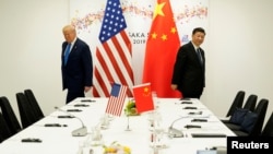 资料图: 2019年6月29日时任美国总统特朗普在日本大阪出席与中国国家主席习近平的双边会晤。