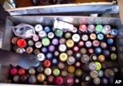 A tagger's arsenal. Maybe a medical mask and a felt-tipped pen or two as well.