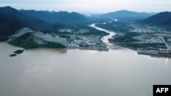 FILE - This frame grab from a video obtained from the Ethiopian Public Broadcaster on July 24, 2020, shows an aerial view of water levels at the Grand Ethiopian Renaissance Dam in Guba, Ethiopia.