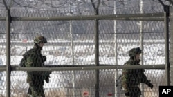 South Korean border guards patrol the fence-line at the Imjingak Pavilion near the border village of Panmunjom in Paju, 01 Jan 2011
