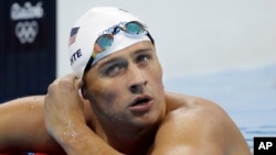 United States' Ryan Lochte checks his time in a men's 4x200-meter freestyle heat during the swimming competitions at the 2016 Summer Olympics, in Rio de Janeiro, Brazil, August 9, 2016.
