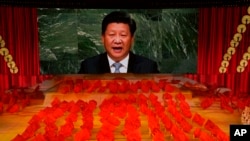 在北京举行的庆祝中共成立100周年的庆典上习近平的画像出现在屏幕上。(2021年6月28日)