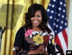 FILE - First lady Michelle Obama speaks at the White House.