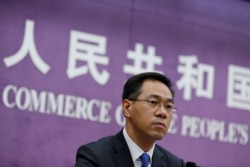 FILE - China's Ministry of Commerce spokesperson, Gao Feng, attends a news conference at the commerce ministry in Beijing, China, June 19, 2018.