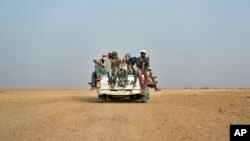 FILE - Nigeriens and third-country migrants head towards Libya from Agadez, Niger, June 4, 2018. 