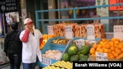 Vendor at food market in New York City's Manhattan Chinatown (October 2013)