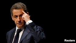 FILE - Nicolas Sarkozy, former head of the Les Republicains political party, attends a Les Republicains (LR) public meeting in Les Sables d'Olonne, France, Oct. 1, 2016. 