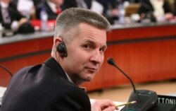 FILE - Latvian Defense Minister Artis Pabriks attends a meeting at NATO headquarters, March 10, 2011.