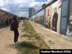 The wall is currently displaying a gallery of pictures and stories about modern war victims, June 30, 2016.