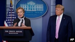 FILE - President Donald Trump listens as White House coronavirus response coordinator Dr. Deborah Birx speaks during a coronavirus task force briefing at the White House, in Washington, April 10, 2020. 
