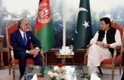 Abdullah Abdullah, chairman of Afghanistan's High Council for National Reconciliation, left, meets with Pakistan Prime Minister Imran Khan, in Islamabad, Sept. 29, 2020. (Credit: Press Information Department)