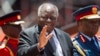 Former Kenyan President Mwai Kibaki arrives for the inauguration of his successor Uhuru Kenyatta, at Kasarani, near Nairobi, Kenya, April 9, 2013. Kibaki has died at the age of 90, President Uhuru Kenyatta announced Friday.