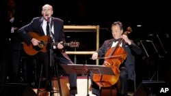 James Taylor (L) performs with cellist Yo-Yo Ma during Carnegie Hall's 125th Anniversary Concert, May 5, 2016, in, New York.