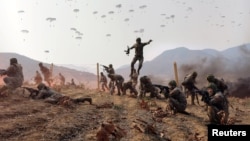 FILE - Soldiers participate in a demonstration during the training of the Korean People's Army's air and amphibious combat units, in this picture released on March 16, 2024 by the Korean Central News Agency. The Pentagon said Pyongyang has sent 10,000 troops to train in Russia.