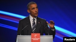 U.S. President Barack Obama gestures as he makes a speach during the opening ceremony of the Hannover Messe in Hanover, Germany, April 24, 2016.