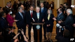 Senate Minority Leader Mitch McConnell of Kentucky talks with reporters at the Capitol, April 5, 2022.