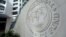 FILE - The International Monetary Fund logo is seen at its headquarters in Washington, Oct. 9, 2016. 