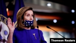 FILE - U.S. House Speaker Nancy Pelosi speaks at a news conference in Washington, October 9, 2020.