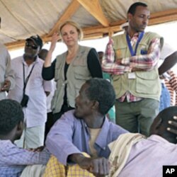 UN World Food Program Executive Director Josette Sheeran meets newly arrived Somali refugees at the Dadaab refugee camp, near the Kenya-Somalia, July 23, 2011