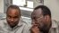 FILE - Chadema party chairman Freeman Mbowe (R) and party's General Secretary John Mnyika sit in the dock at Kisutu resident magistrates court in Dar es Salaam on March 10, 2020. 