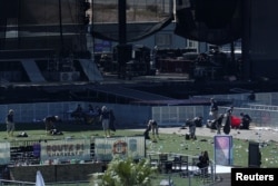An FBI Evidence Response Team investigates the crime scene in front of the stage area following the mass shooting in Las Vegas, Nevada, Oct. 4, 2017.