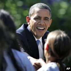 U.S. President Barack Obama shakes hands at a reception for the Texas A&M 2011 NCAA women's basketball championship team at the White House, October 6, 2011