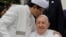 FILE - The Grand Imam of Istiqlal Mosque Nasaruddin Umar, left, hugs Pope Francis during a family photo following an interreligious meeting with religious leaders at the Istiqlal Mosque in Jakarta, Sept. 5, 2024. 