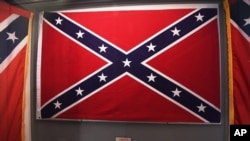 Confederate flags that once flew at the South Carolina Statehouse are displayed at the South Carolina State Museum, June 24, 2015, in Columbia. 