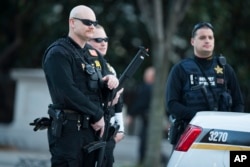 Secret Service police stand guard outside the White House after a man was caught jumping the fence Nov. 26, 2015, as President Barack Obama and his family ate Thanksgiving dinner.