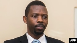 FILE - Philippe Mpayimana speaks to the media during his first press conference in Kigali, Rwanda, Feb. 4, 2017.