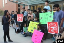 Edith Galvan, an undocumented immigrant, leads a vigil in Raleigh, North Carolina. Galvan was brought to the U.S. as a child, and she is one of the 750,000 approved for deportation relief under the DACA program. (Photo: A. Barros / VOA)