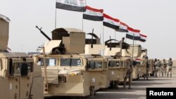 FILE - Iraqi security forces ride in vehicles towards to Mosul, Feb. 21, 2016. The city has been now been controlled by IS militants for more than two years.